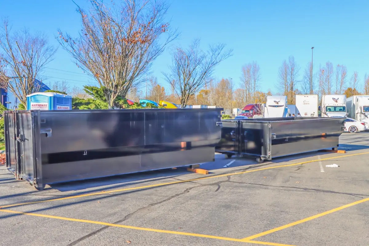 Professional dumpster rental service with roll-off container on residential driveway in Wadsworth